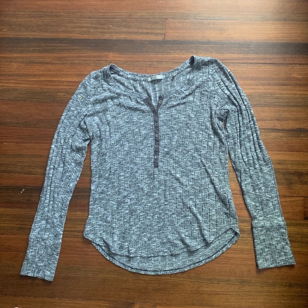 long sleeve half button shirt with a low neck